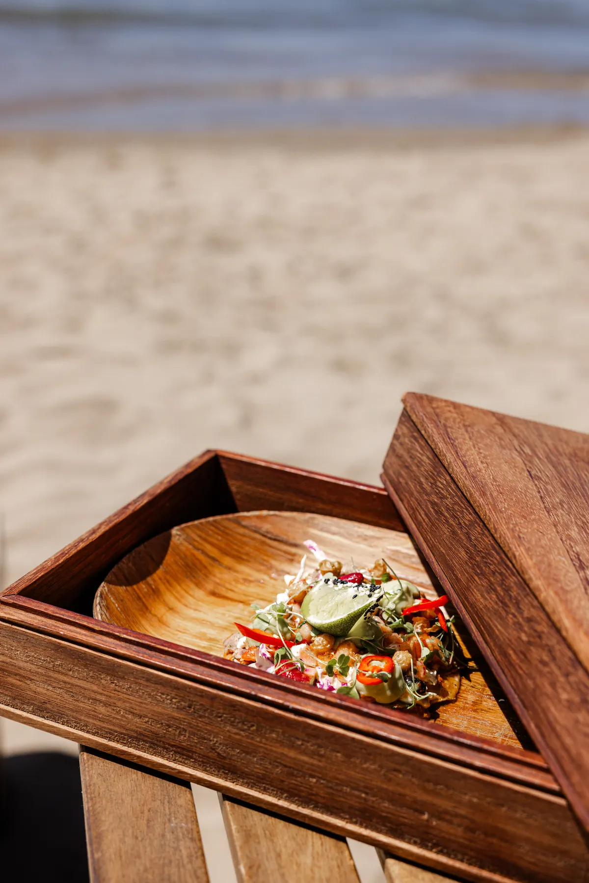 Lunch served in a wooden beach box on the sand