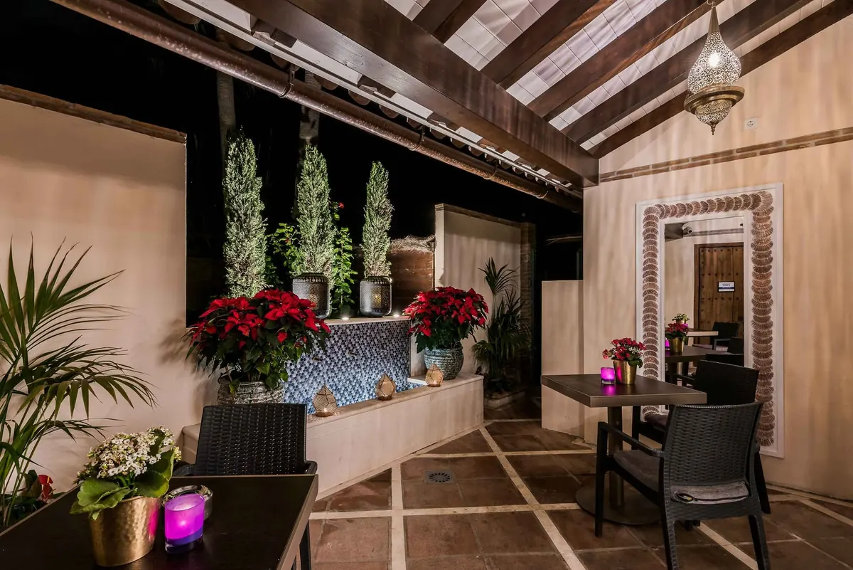 The interior dining room dressed with poinsettias for the festive season