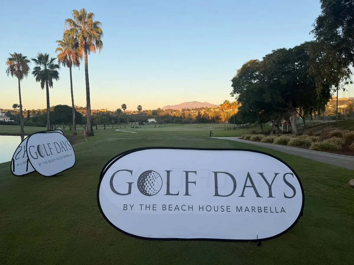 A Golf Days by The Beach House Marbella sign on the course at sunrise