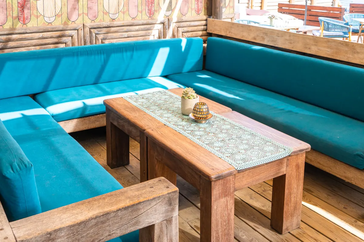 A corner of the beach lounge with turquoise seating