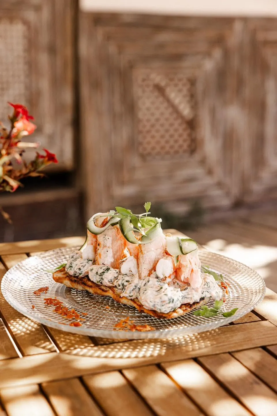 Prawns and cucumber on a crisp base, served on glass