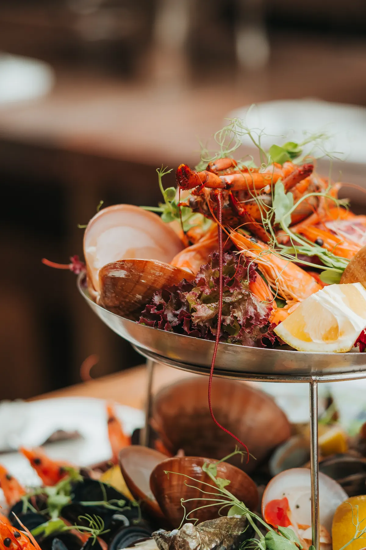 A tiered seafood platter with prawns and shellfish