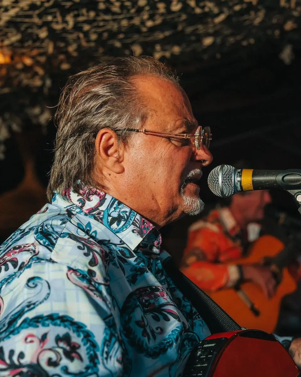 A singer performing with guitar accompaniment