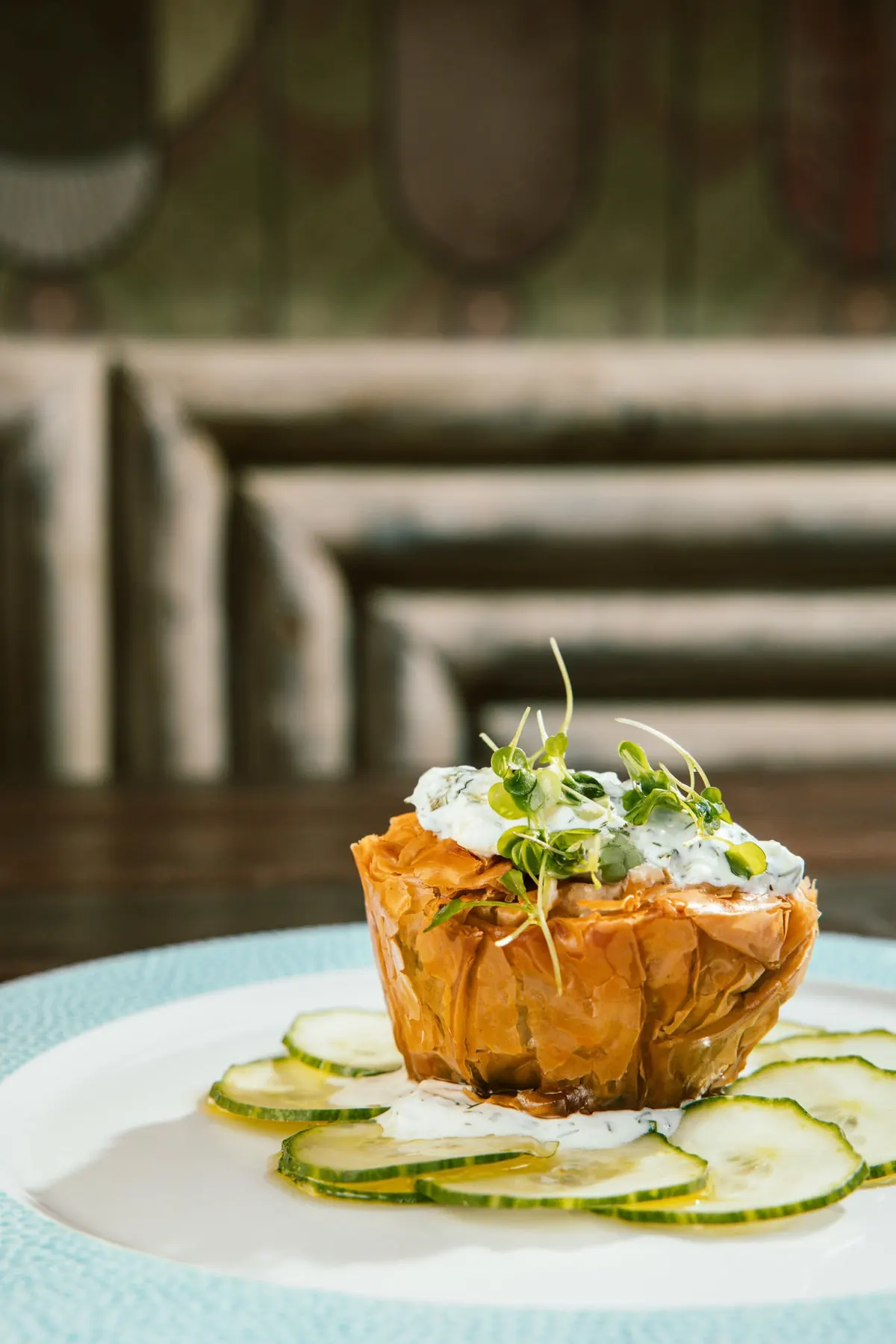 Spinach and feta filo parcel on cucumber carpaccio